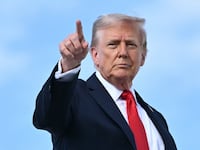 US President Donald Trump points as he boards Air Force One at Joint Base Andrews, Maryland, on September 11, 2025.