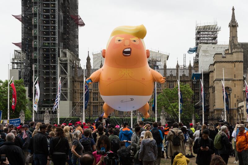 LONDON, UNITED KINGDOM - JUNE 04: A 20-feet tall "Trump Baby" balloon depicting the President of the United Stetes as an angry orange infant with a smartphone, flies above Parliament Square on the second day of Donald Trump's three-day state visit to the United Kingdom on 04 June, 2019 in London, England. (Photo credit should read Wiktor Szymanowicz/Future Publishing via Getty Images)
