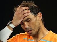 Rafael Nadal looks dejected after losing his second round match against Mackenzie Mcdonald of the Australian Open in Melbourne, Australia, Jan. 18, 2023.