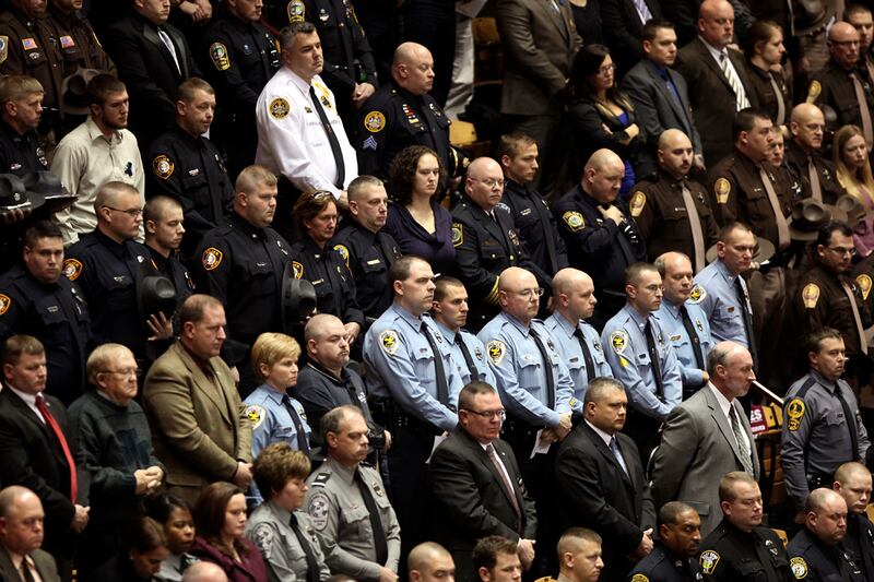 articles/2011/12/17/more-cops-shot-as-felons-buy-illegal-guns-online/cops-guns-dzieza_bmaygk