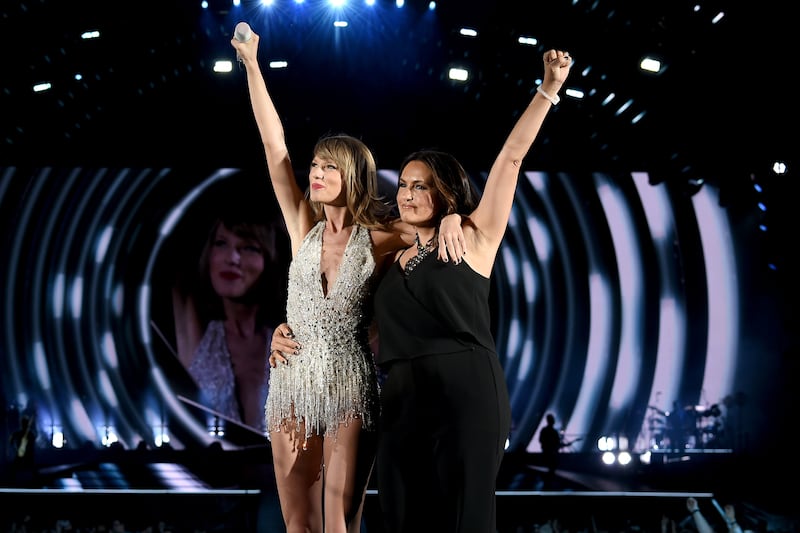 Taylor Swift performs onstage with actress Mariska Hargitay during The 1989 World Tour on June 13, 2015 at Lincoln Financial Field in Philadelphia, Pennsylvania.