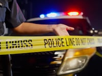 yellow crime scene tape that reads 'POLICE LINE DO NOT CROSS'