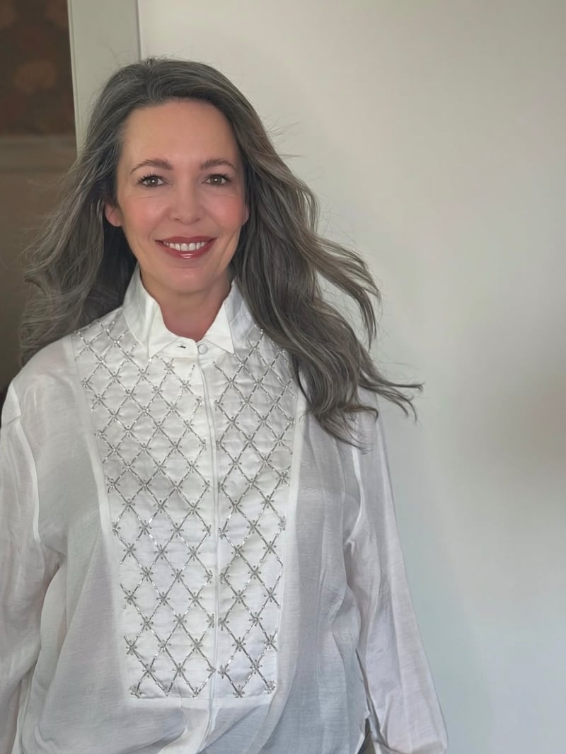 Olivia Colman wowed with her silky gray hair, styled by Marcus Francis.