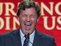 Political commentator Tucker Carlson speaks during the memorial service for political activist Charlie Kirk at State Farm Stadium on September 21,