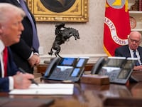 Media mogul Rupert Murdoch looks on as President Donald Trump speaks to members of the media as he signs proclamations, initiatives and appointments inside the Oval Office at the White House in Washington, DC on February 03, 2025.