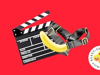 A film clapboard with a banana inside a harness