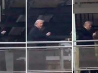 Donald Trump points and flips the bird at a factory worker.