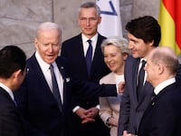 A photo of President Joe Biden meeting with world leaders during the 2022 NATO summit in Belgium.