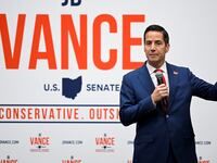 Bernie Moreno introduces JD Vance and Donald Trump Jr. at an event.