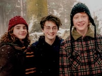Emma Watson (L), Daniel Radcliffe (M), and Rupert Grint (R). Photo by Murray Close/ Getty Images.