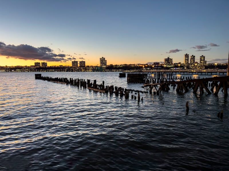 Hudson River and New Jersey landscape as viewed from Riverside Park South at sunset on the Upper West Side of Manhattan in New York City, New York.