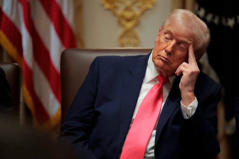 President Donald Trump's eyes close as he attends a meeting of his Cabinet in the Cabinet Room of the White House on December 02, 2025 in Washington, DC.
