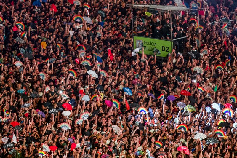 Military Police officers stand on an elevated platform as fans wait for the beginning of the free mega-concert of US pop star Lady Gaga at Copacabana beach in Rio de Janeiro, Brazil, on May 3, 2025. Brazilian police said Sunday they had arrested two people in connection with a foiled plot to attack Lady Gaga's packed mega-concert in Rio de Janeiro. (Photo by Daniel RAMALHO / AFP) (Photo by DANIEL RAMALHO/AFP via Getty Images)