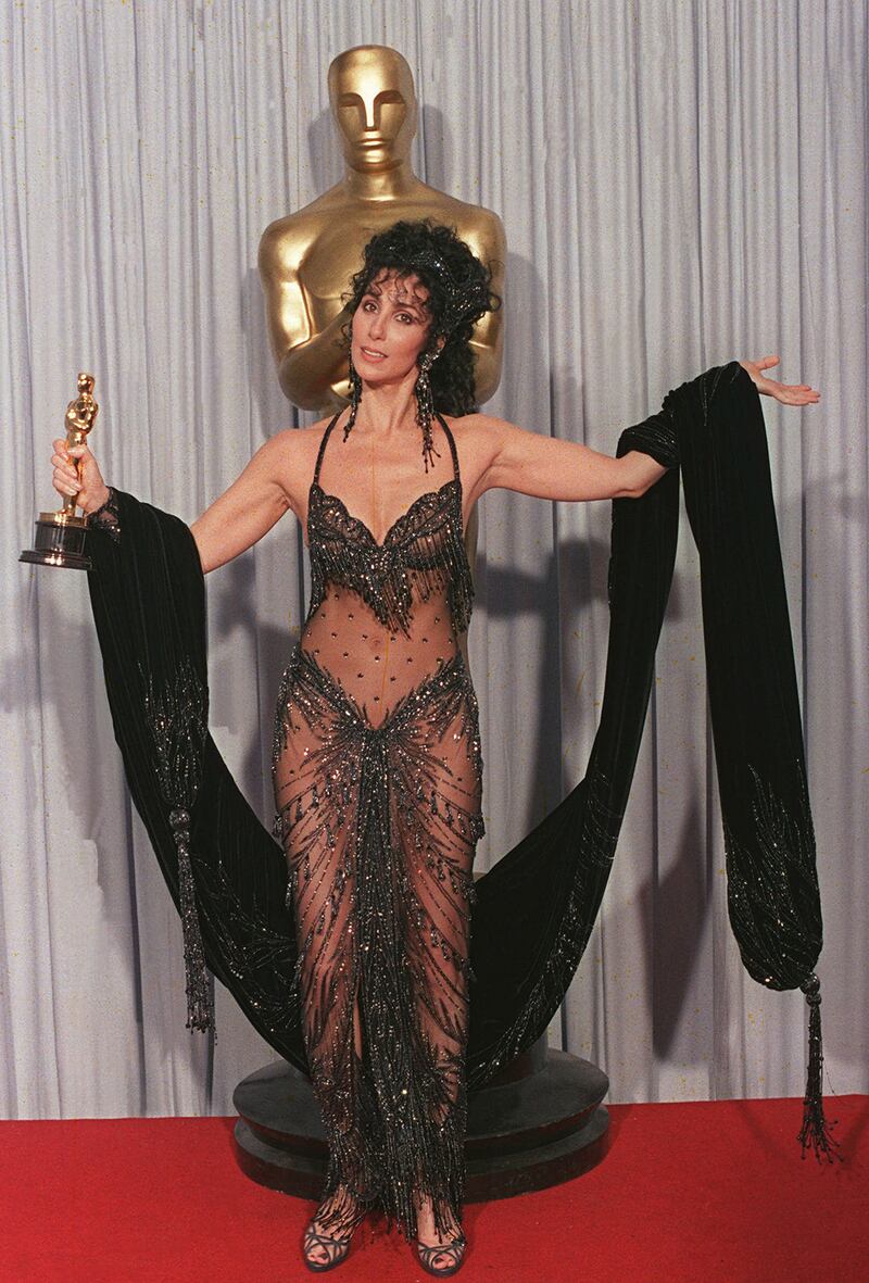 Cher stunned at the 1988 Academy Awards in a sheer Bob Mackie gown. Here pictured holding the Best Actress Oscar she won for the 1987 romantic comedy "Moonstruck."