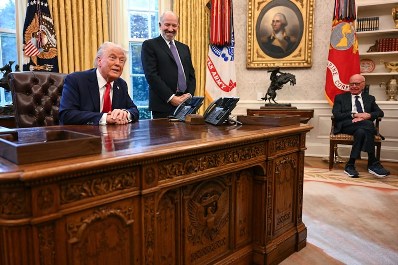 Rupert Murdoch looks on as President Donald Trump speaks to the press after signing an executive order to create a U.S. sovereign wealth fund.
