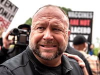 Infowars founder Alex Jones interacts with supporters at the Texas State Capital building on April 18, 2020 in Austin, Texas.