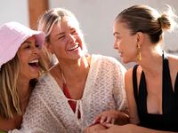 Scheana Shay, Ariana Madix, Lala Kent sit and laugh togehter in a still from Vanderpump Rules
