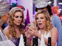 Ramona Singer looks at a phone with a shocked expression in "The Real Housewives of New York"