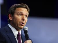Florida Governor Ron Desantis speaks as he is interviewed by former Fox News commentator Tucker Carlson.