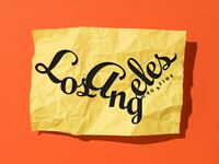 The Los Angeles magazine logo illustrated over a crumpled piece of paper.