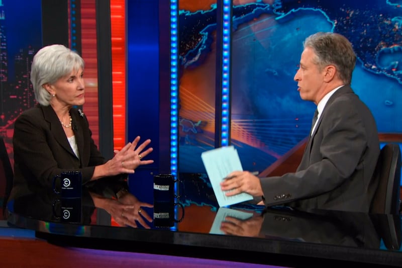 articles/2013/10/08/kathleen-sibelius-s-daily-show-disaster-jon-stewart-slams-obamacare-rules/131008-sibelius-daily-show-grove-tease_msk6gt