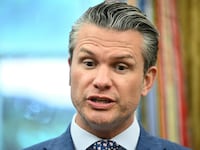 Secretary of Defense Pete Hegseth speaks in the Oval Office of the White House.
