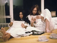 Yoko Ono and John Lennon sit up in bed at the Hilton hotel in Amsterdam, Netherlands in March 1969.