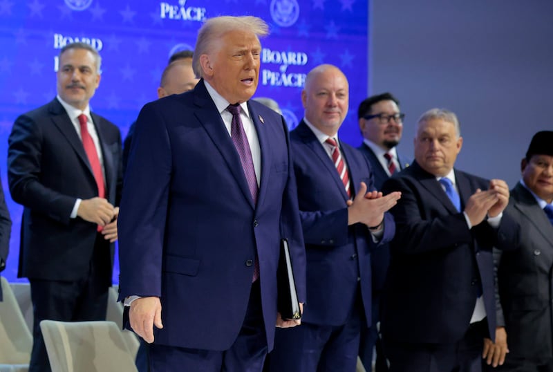 DAVOS, SWITZERLAND - JANUARY 22: U.S. President Donald Trump presents the “Board of Peace” onstage at the World Economic Forum (WEF) on January 22, 2026 in Davos, Switzerland. The annual meeting of political and business leaders comes amid rising tensions between the United States and Europe over a range of issues, including Trump's vow to acquire Greenland, a semi-autonomous Danish territory. (Photo by Chip Somodevilla/Getty Images)