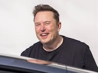 Elon Musk gets in a car as he leaves the Tesla Gigafactory on March 13, 2024 near Gruenheide, Germany.