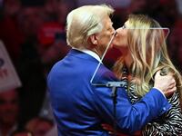 Donald Trump joins his wife Melania Trump on stage during a campaign rally at Madison Square Garden.