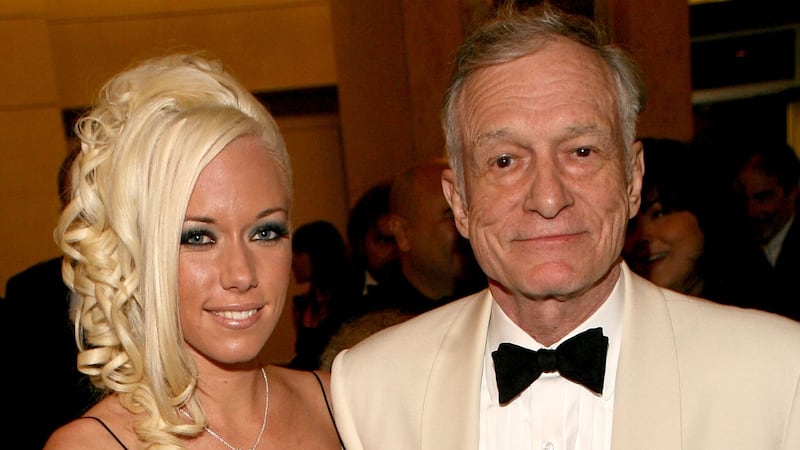 Playboy's Hugh Hefner (R) and girlfriend Playmate Kendra Wilkinson depart the 34th AFI Life Achievement Award tribute to Sir Sean Connery held at the Kodak Theatre on June 8, 2006 in Hollywood, California.