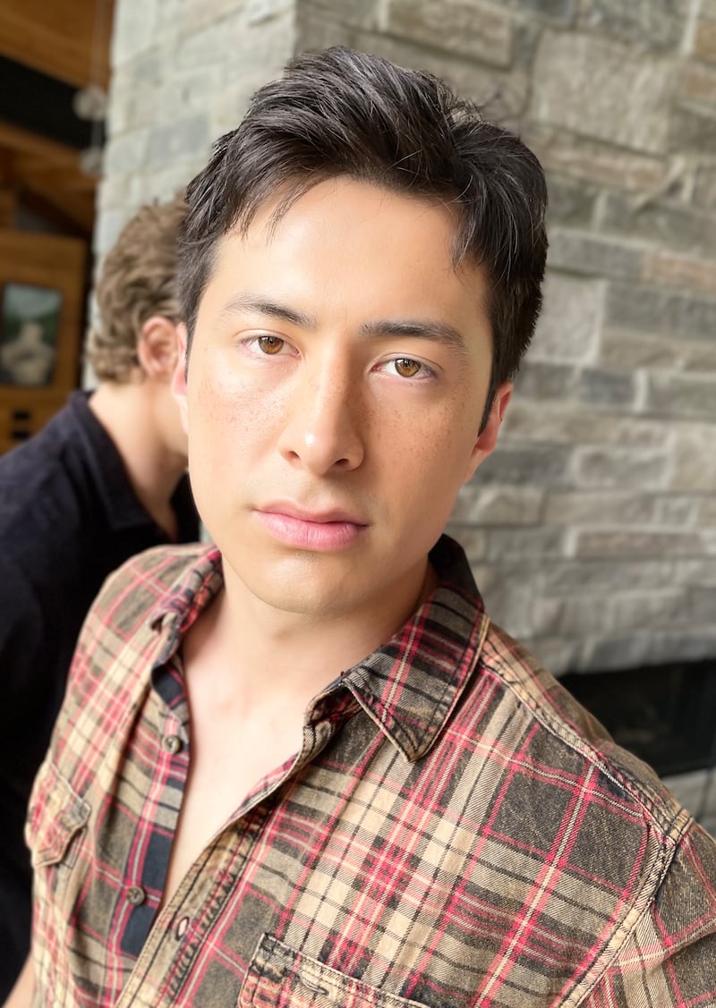 A behind-the-scenes photo of Hudson Williams's makeup on set.