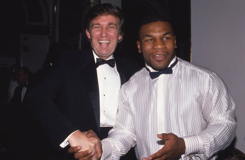 NEW YORK, NY - 1989: Donald Trump and Mike Tyson attend a March of Dimes dinner in November 1989 in New York City.