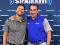 DURHAM, NC - MAY 31: Duke basketball head coach Mike Krzyzewski (R) and SiriusXM host Chris Spatola pose for a photo during SiriusXM's Town Hall With Hall Of Fame Coach Mike Krzyzewski at Bill Brill Media Room in Cameron Indoor Stadium on May 31, 2018 in Durham, North Carolina. (Photo by Lance King/Getty Images for SiriusXM)