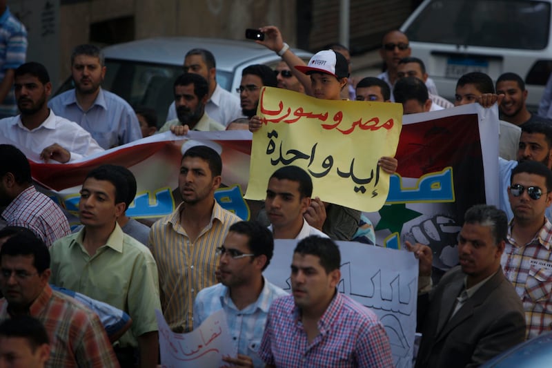 articles/2013/05/03/desperate-to-go-to-war-syrians-in-egypt-find-an-ally-to-help/130502-Syrians-Egypt-tease_i1bkk8