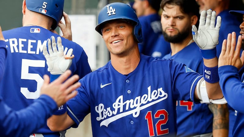 Alex Call #12 of the Los Angeles Dodgers celebrates with teammates in the third inning during the game between the Los Angeles Dodgers and the Minnesota Twins in June, 2026.