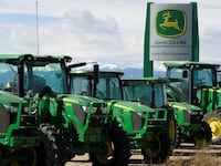 John Deere tractors are seen for sale at a dealer in Longmont, Colorado, Feb. 21, 2017.
