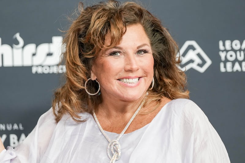 Abby Lee Miller said that her earring holes were so stretched that her hoop earrings would flip around with their backs. Pictured here in Beverly Hills in 2022.