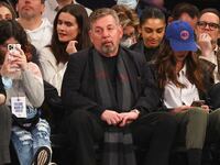 James Dolan sits courtside at a Knicks game