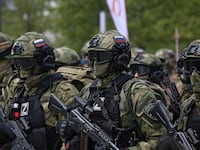 Service members take part in a military parade on Victory Day, which marks the 77th anniversary of the victory over Nazi Germany in World War II, in Grozny, Russia, May 9, 2022.