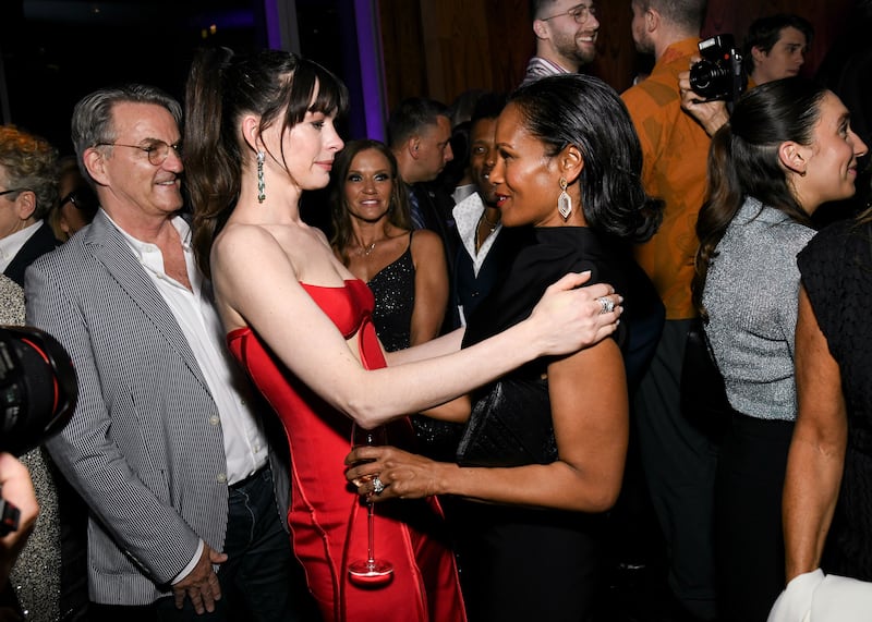 Robinne Lee and Anne Hathaway hug at the premiere of 'The Idea of You'