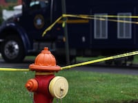 Crime scene tape hangs near the residence of architect Rex Heuermann, who was arrested in connection with serial killings more than a decade ago in Gilgo beach, in Massapequa Park, New York, July 19, 2023.