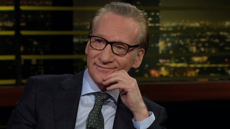 Real Time host Bill Maher sits on set of his HBO tv show.