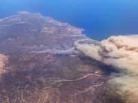 A wildfire spreads across the Greek island of Rhodes.