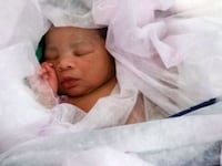 articles/2015/05/04/the-immigrant-baby-born-on-the-high-seas/150504-barbie-baby-hazmat-tease_qugn5e