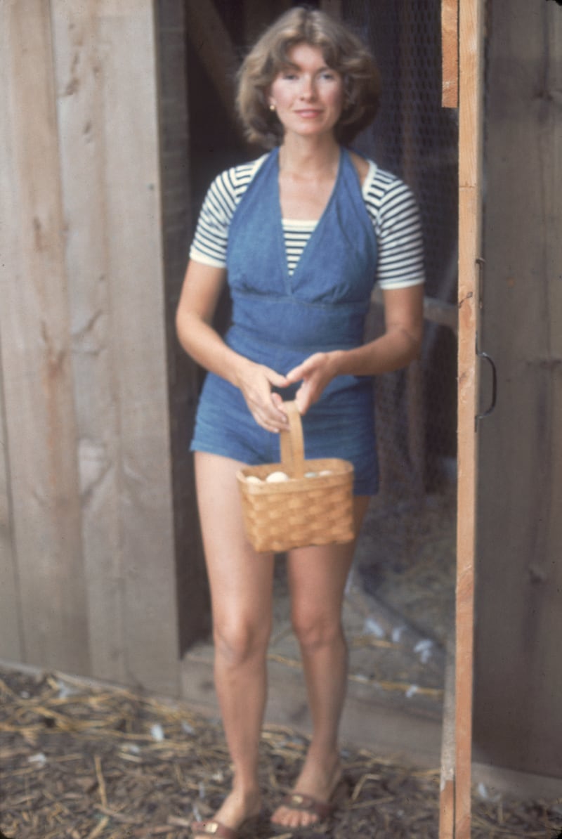 American media mogul and businesswoman Martha Stewart exits a chicken coop with a basket of eggs, August 1976. (Photo by Susan Wood/Getty Images)