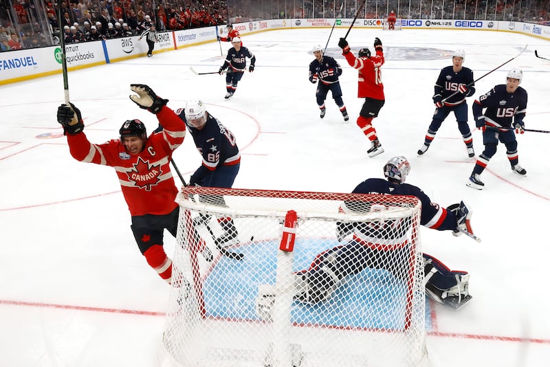 Canadian players celebrate after scoring against Team USA during Thursday's championship game.