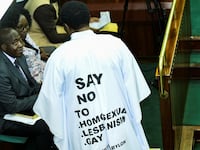 John Musira, a member of Parliament from Bubulo constituency, dressed in an anti-gay gown, attends the debate of the anti-homosexuality bill inside the chambers.