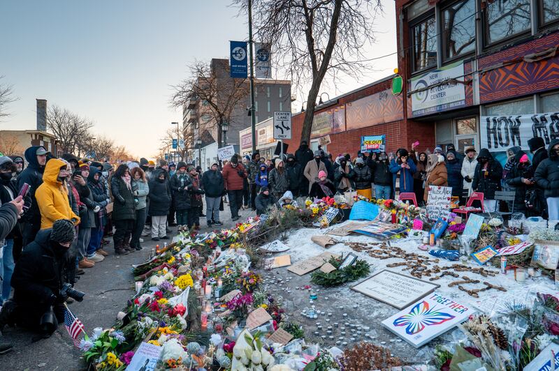 People pay their respects at a memorial site for Alex Pretti on January 25, 2026 in Minneapolis, Minnesota. Pretti was shot and killed by federal agents amid a scuffle to arrest him on January 24.