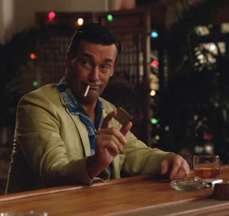 Don Draper (Jon Hamm) wears a blue Hawaiian shirt and khaki jacket in Season 6, Episode 1 of "Mad Men."